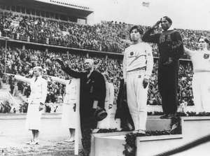 Jesse Owens podium winners gold medal 1936 1936